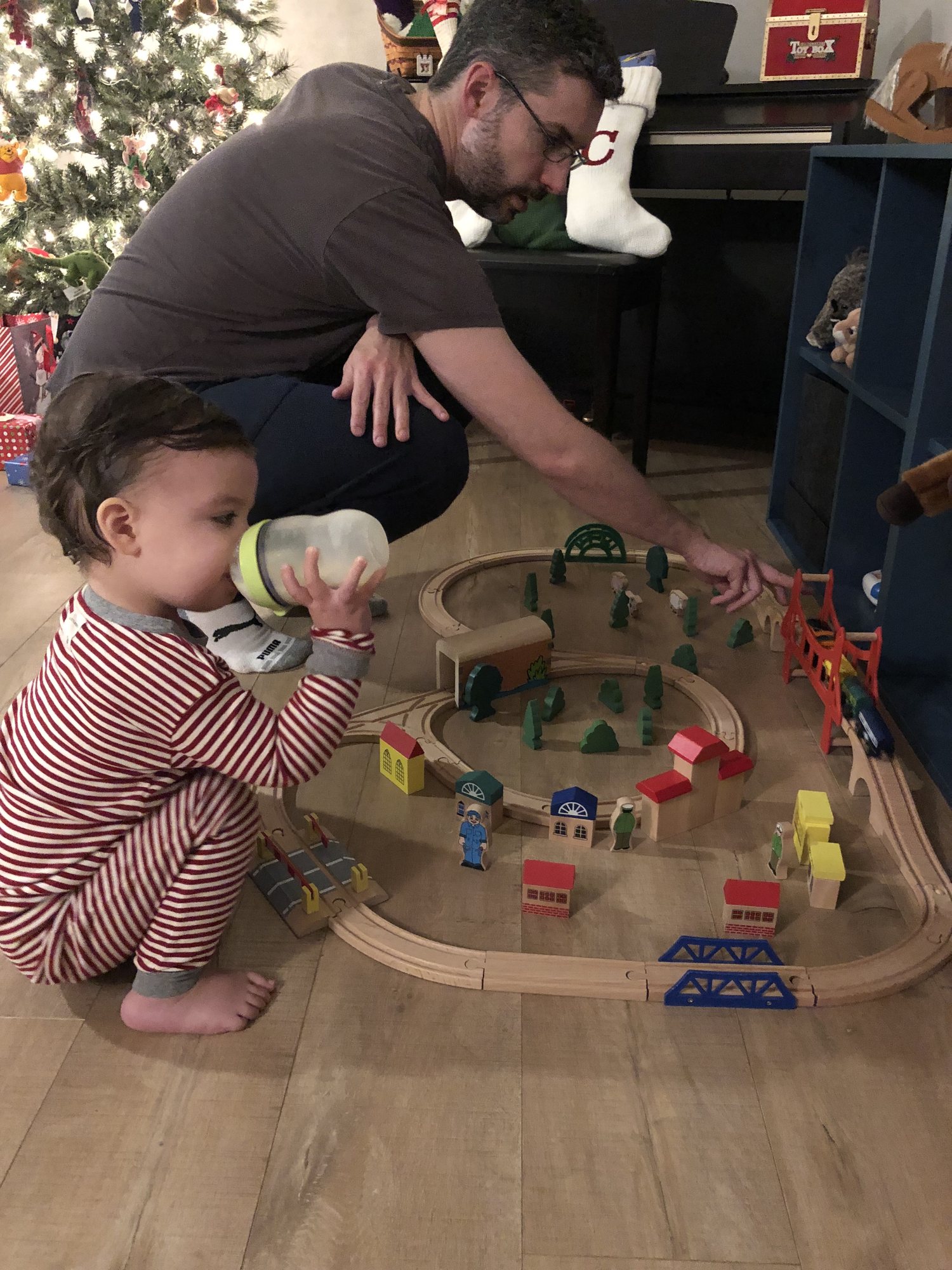 Ben checks out his train set on Christmas morning.