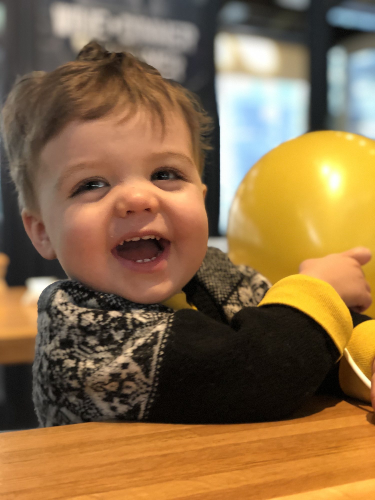 Playing with his haircut balloon :)