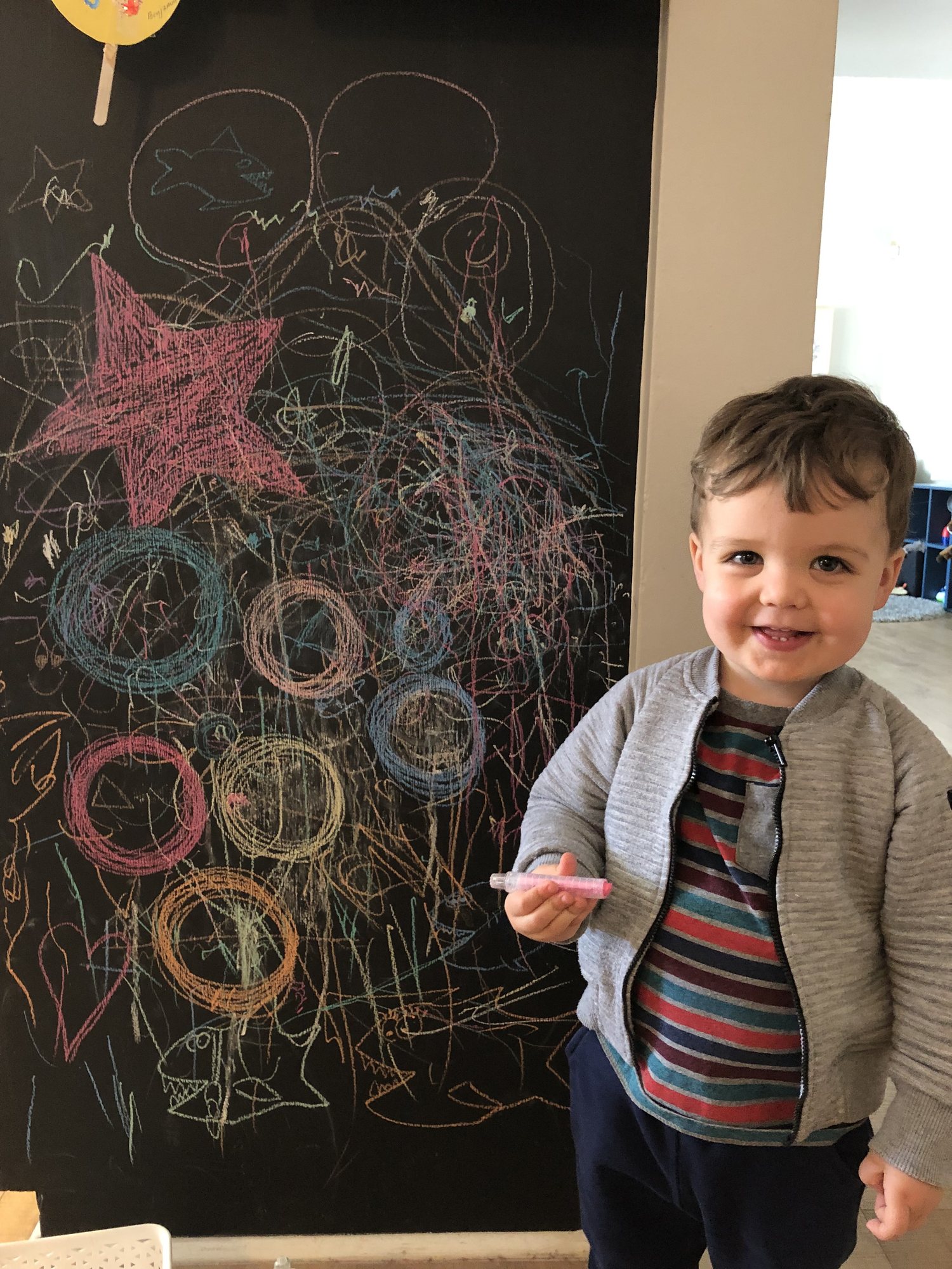 Ben's very proud of the family art :)