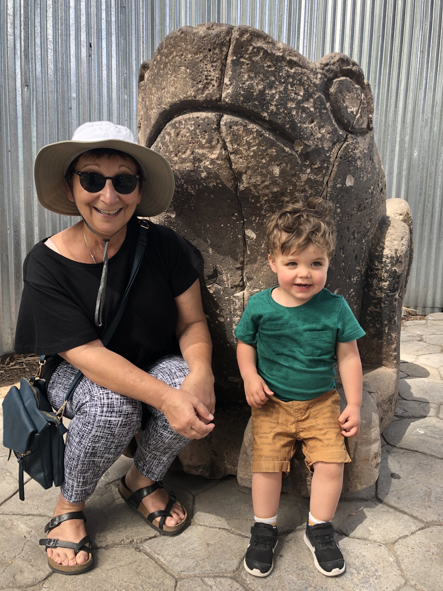 Happy about sitting on a frog with Nonna at the Phoenix Zoo.
