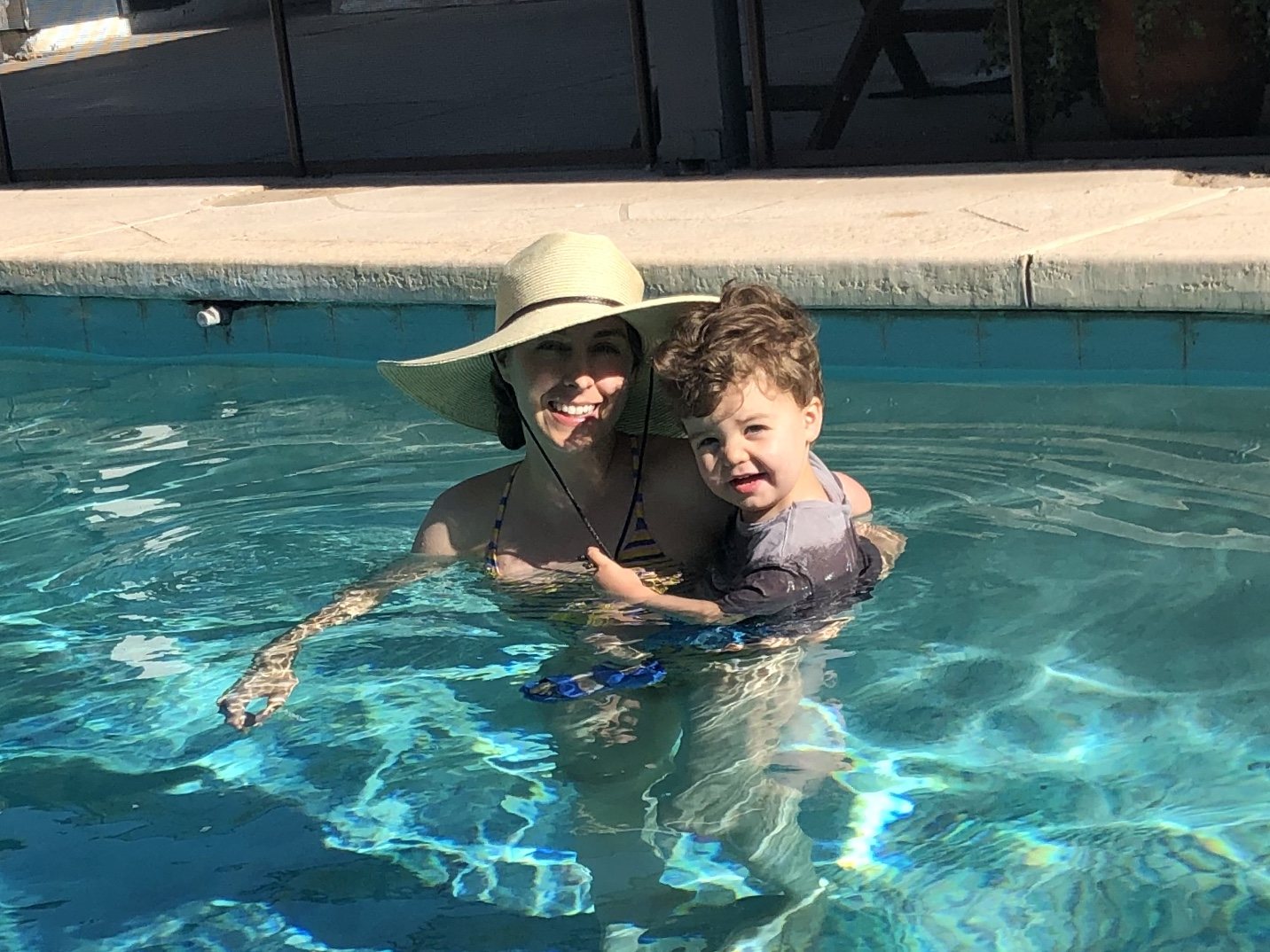 Taking a swim with mama. He laughed maniacally when I put him in the pool. Lol.