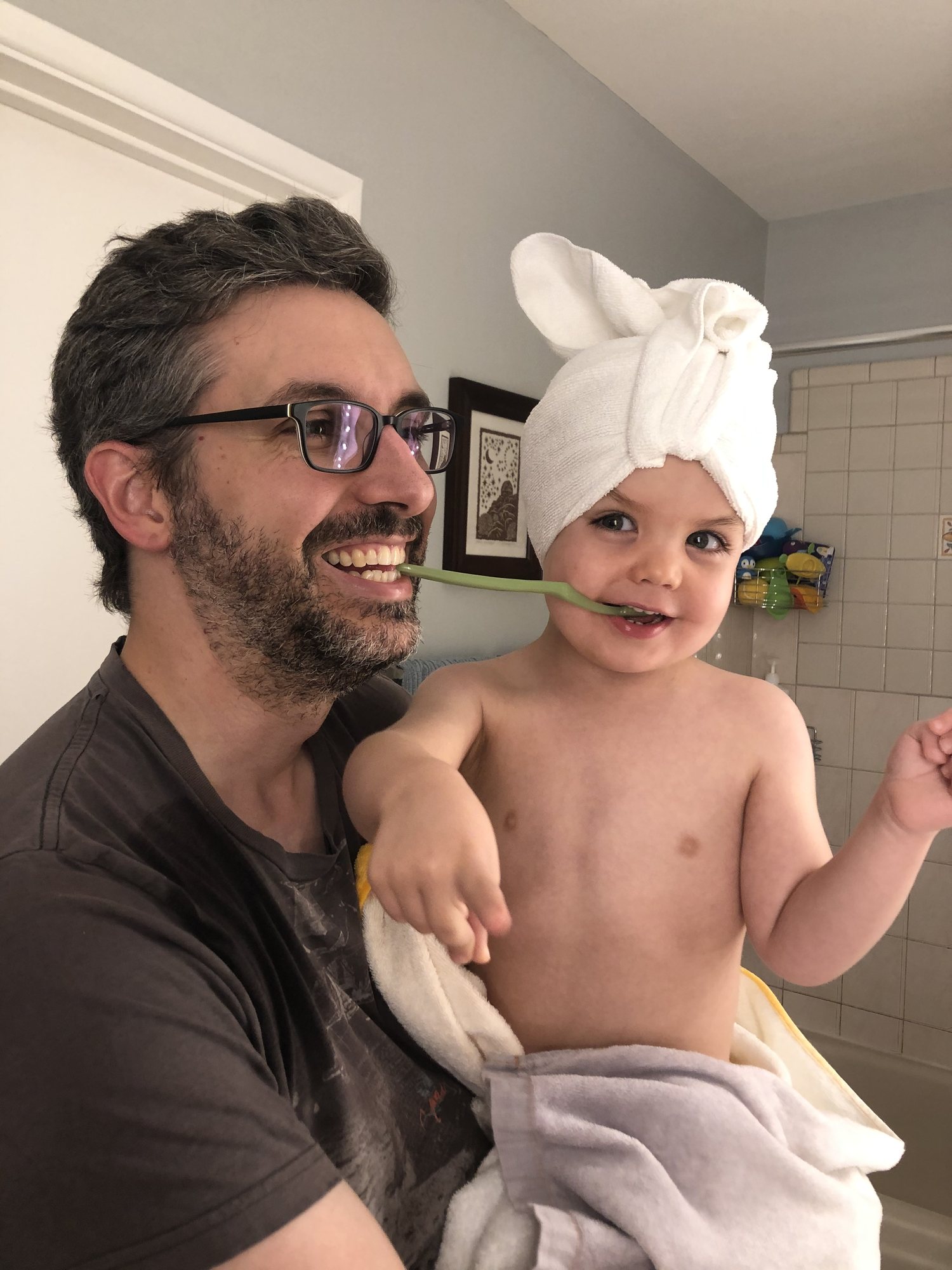 That's NOT how you're supposed to brush Ben's teeth, Dad. LOL.