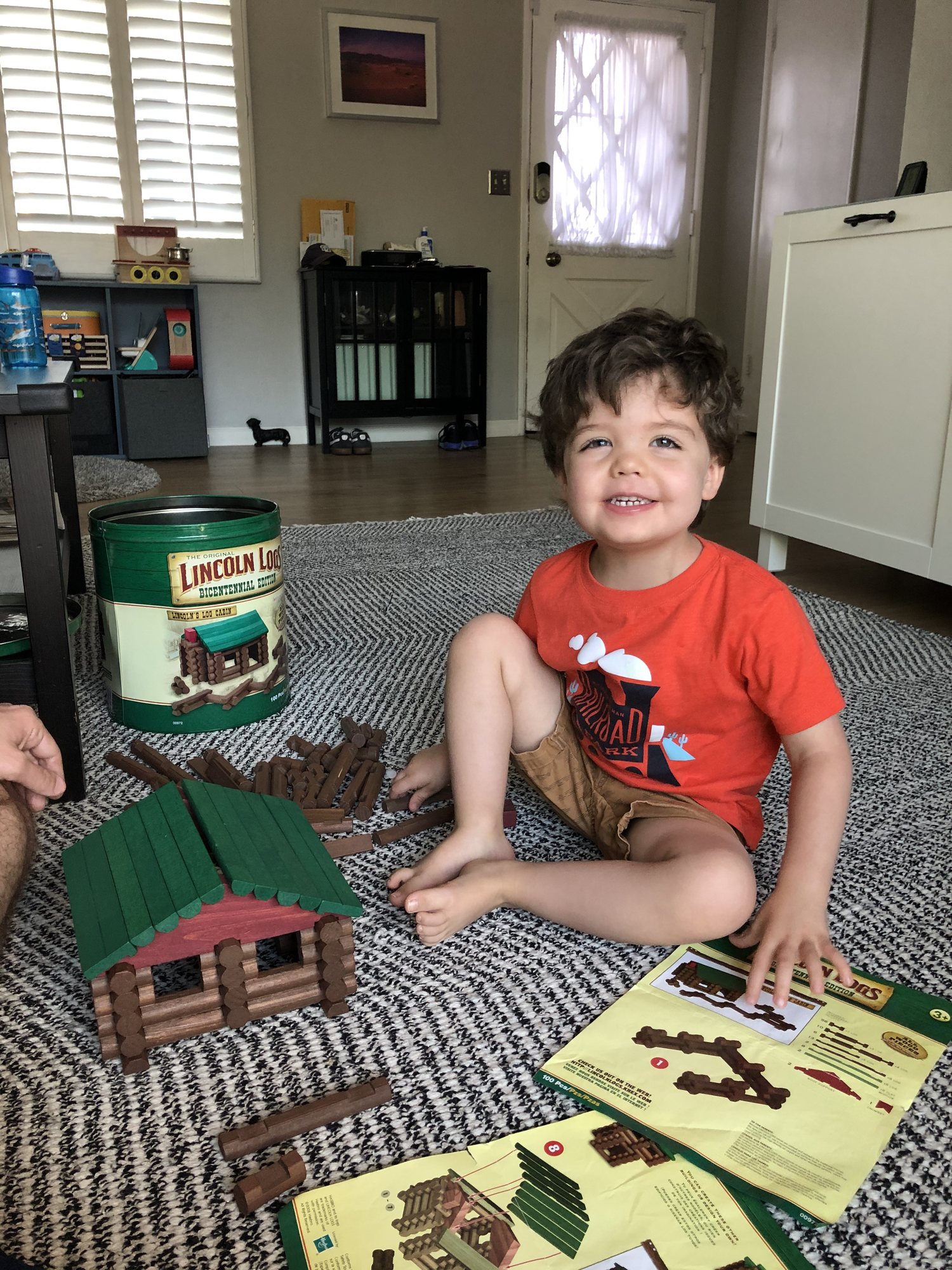 Building a Lincoln Log cabin. He was very proud :)