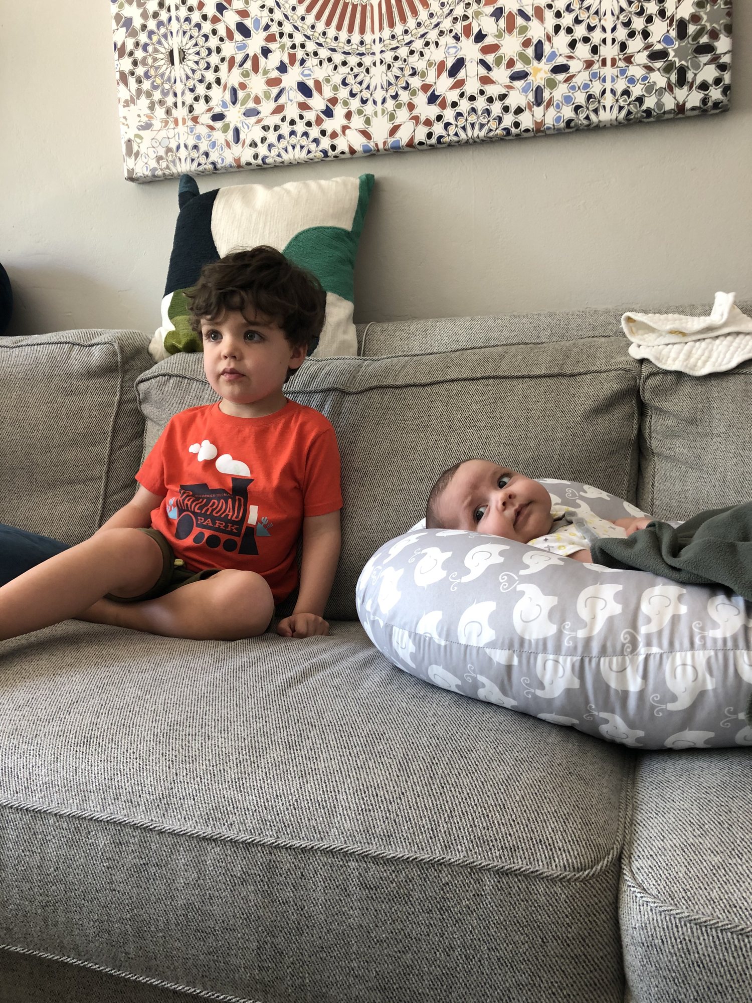 Watching Mickey Mouse's Clubhouse together. Also some excellent parenting on our part. Don't worry, Nora only watches for a minute or two.