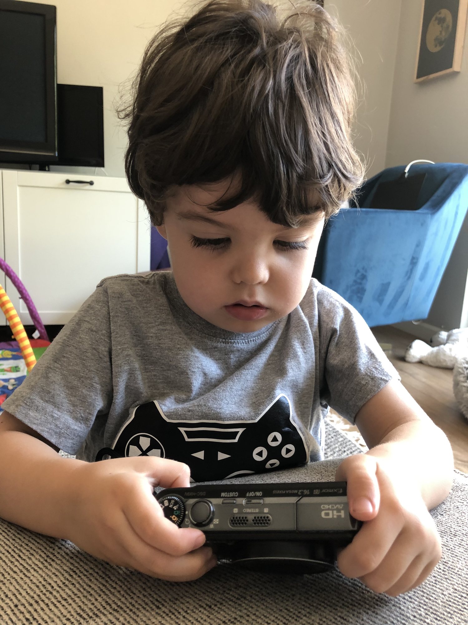 This kid is serious about his photography.