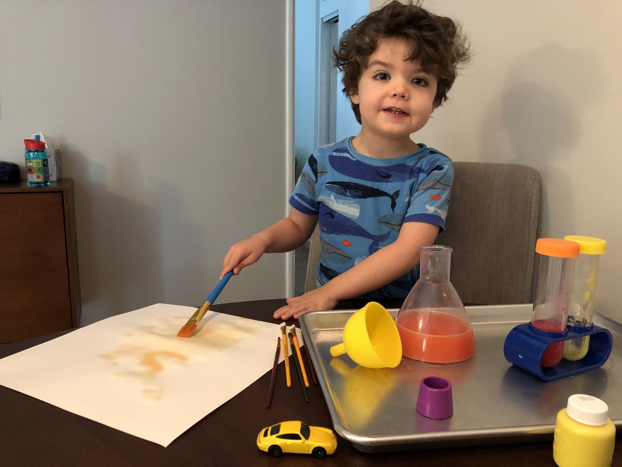 Ben made some orange paint! His painting looked like a water color when he was done :)