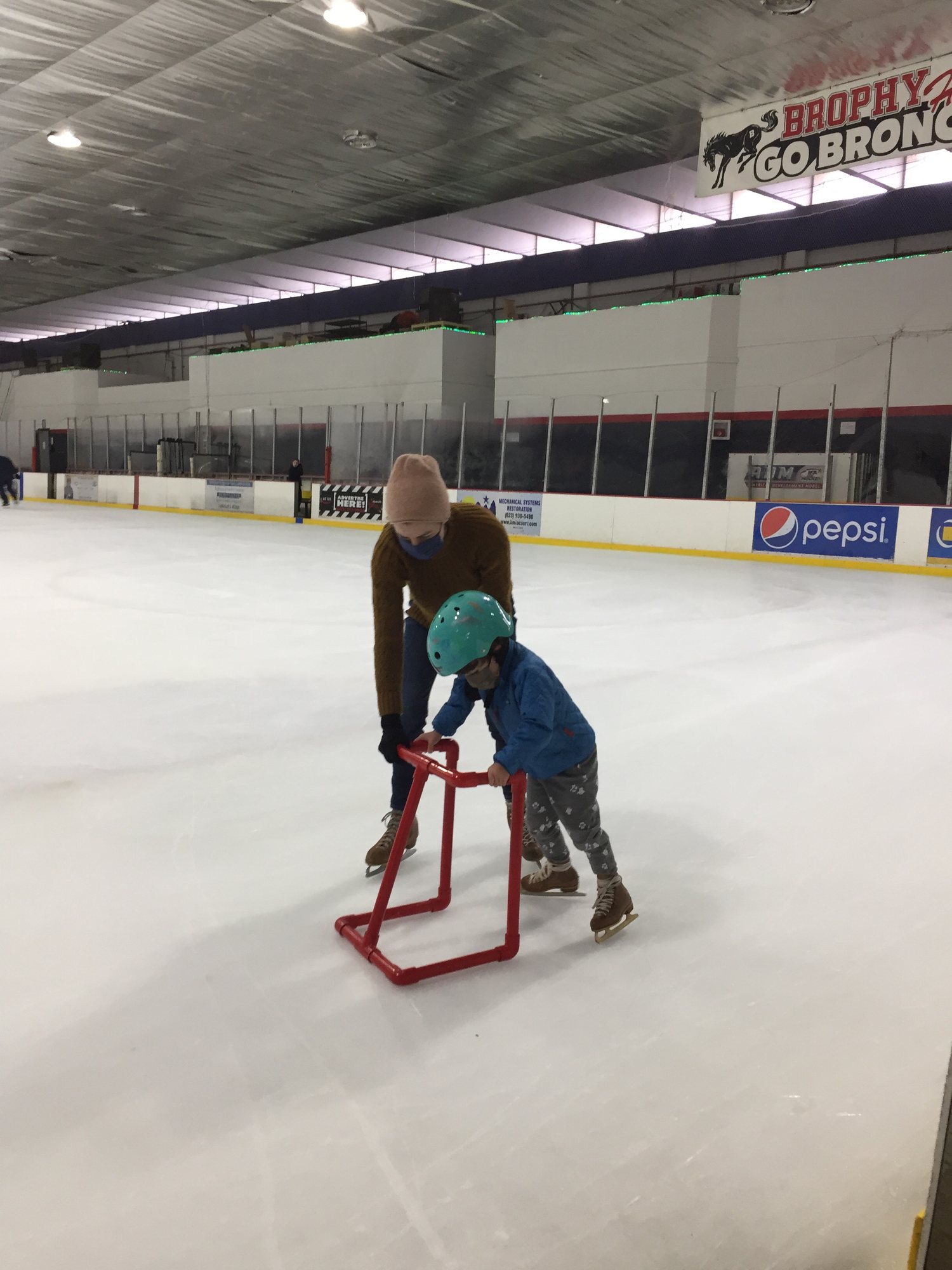 Ben learning to ice skate. He did really well after a few times around the rink's Christmas tree.