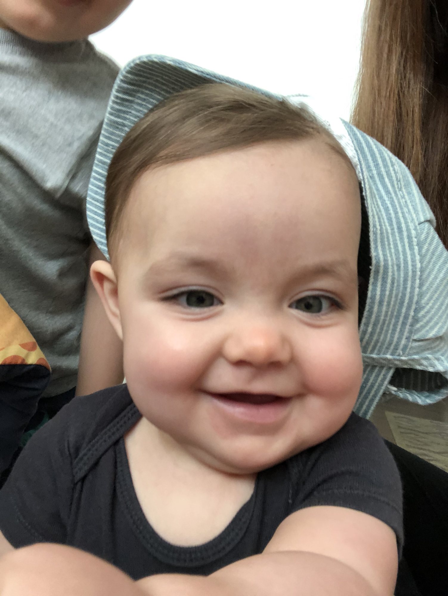 Can't keep her hat on, but look at those cheeks!!!