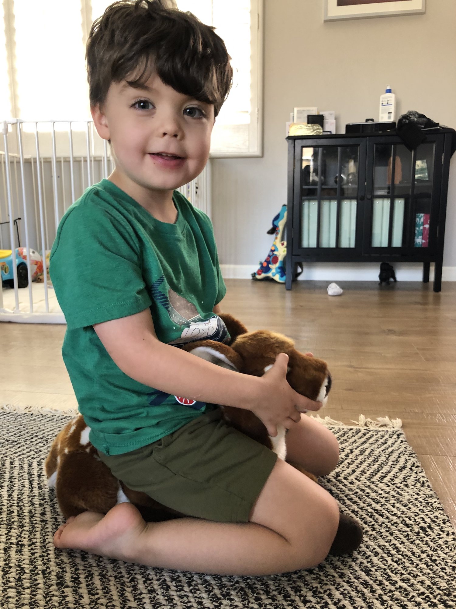 Riding his baby deer.