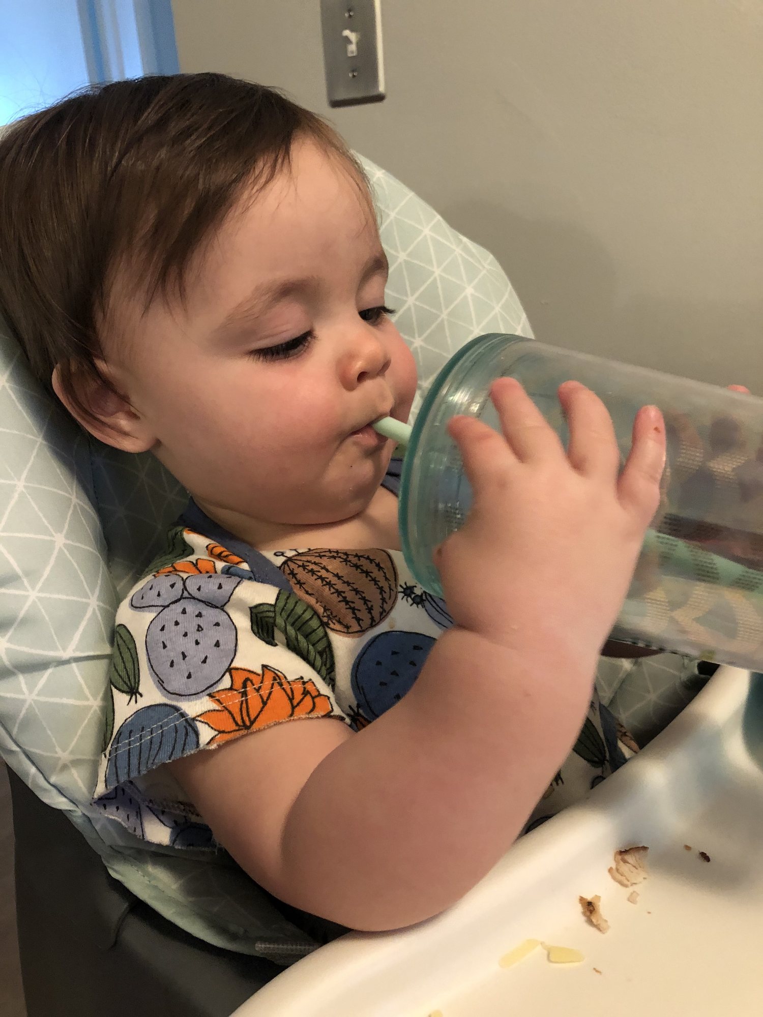 Learning to use a straw.