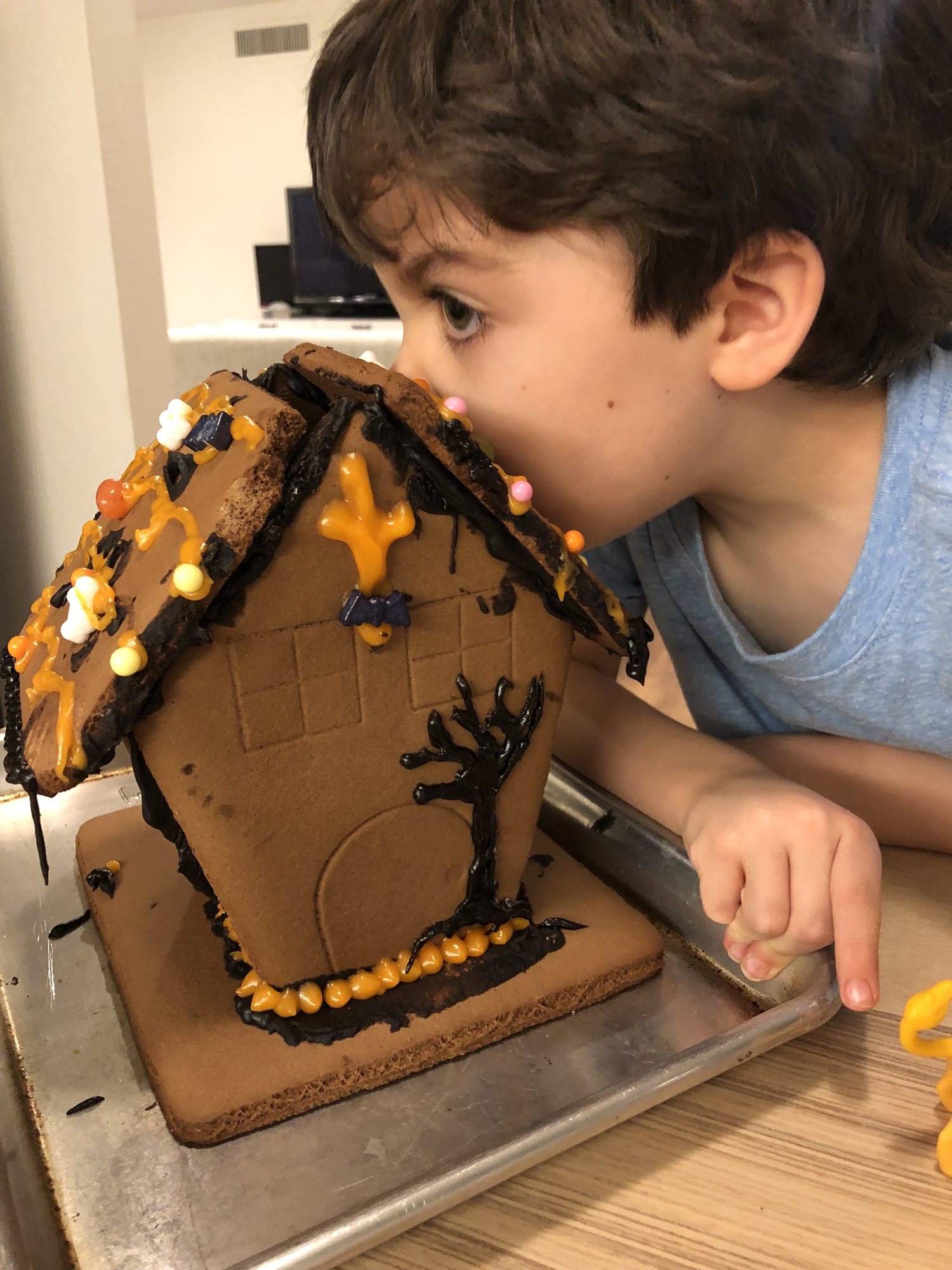 Ben eating his haunted gingerbread house.
