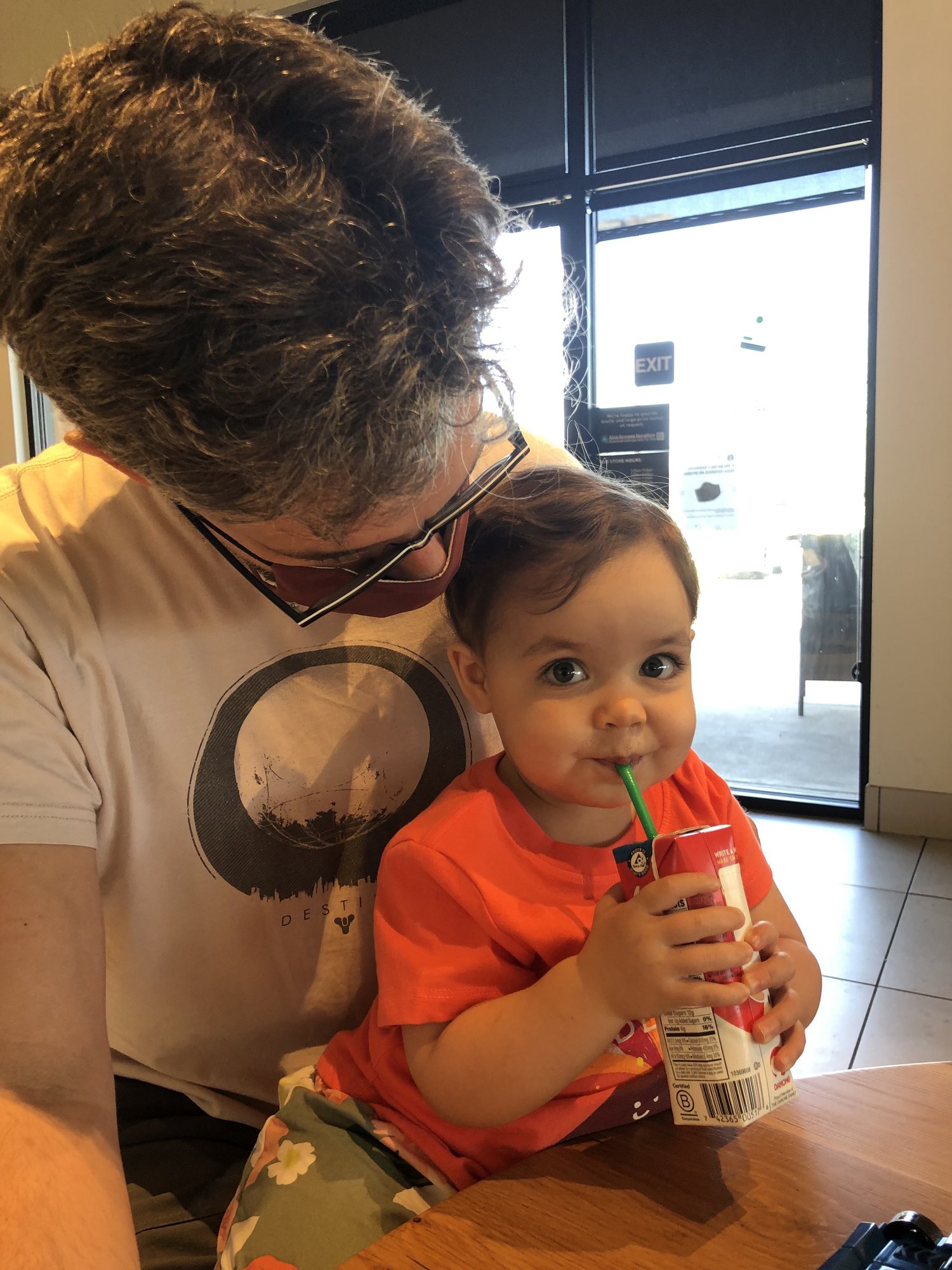 Time for some milk with dad.