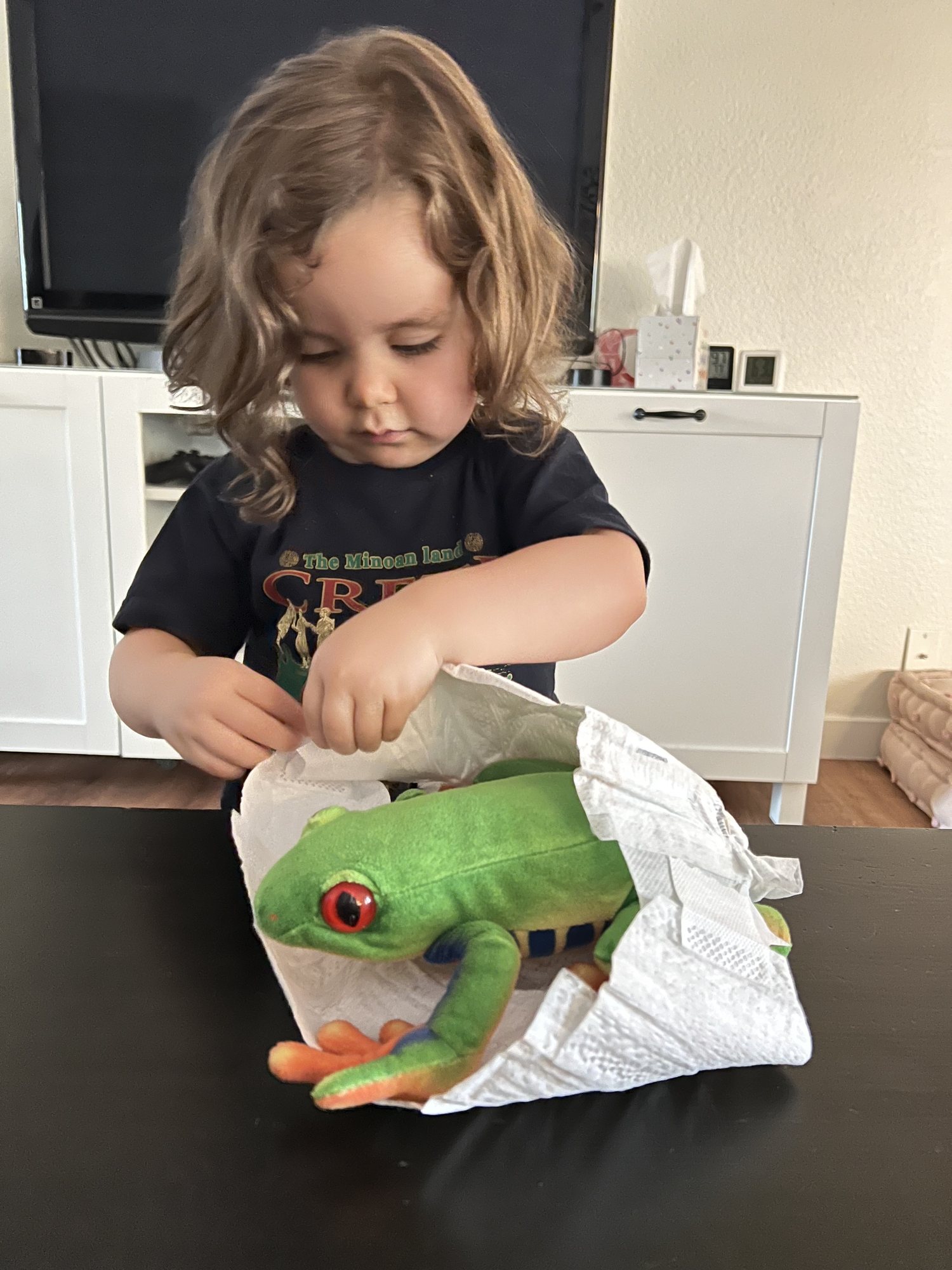 Diapering her frog :)
