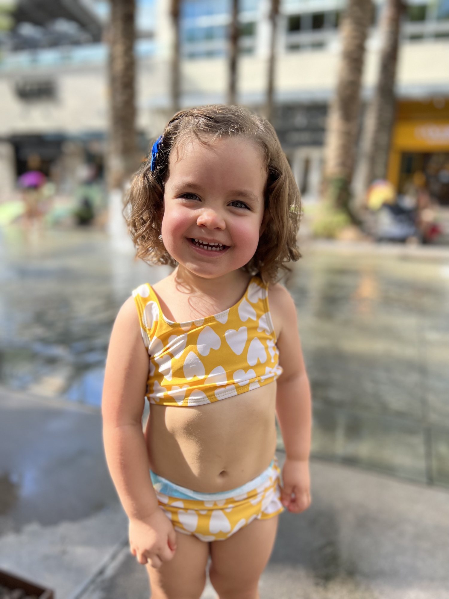 Post-haircut fun at the splashpad.