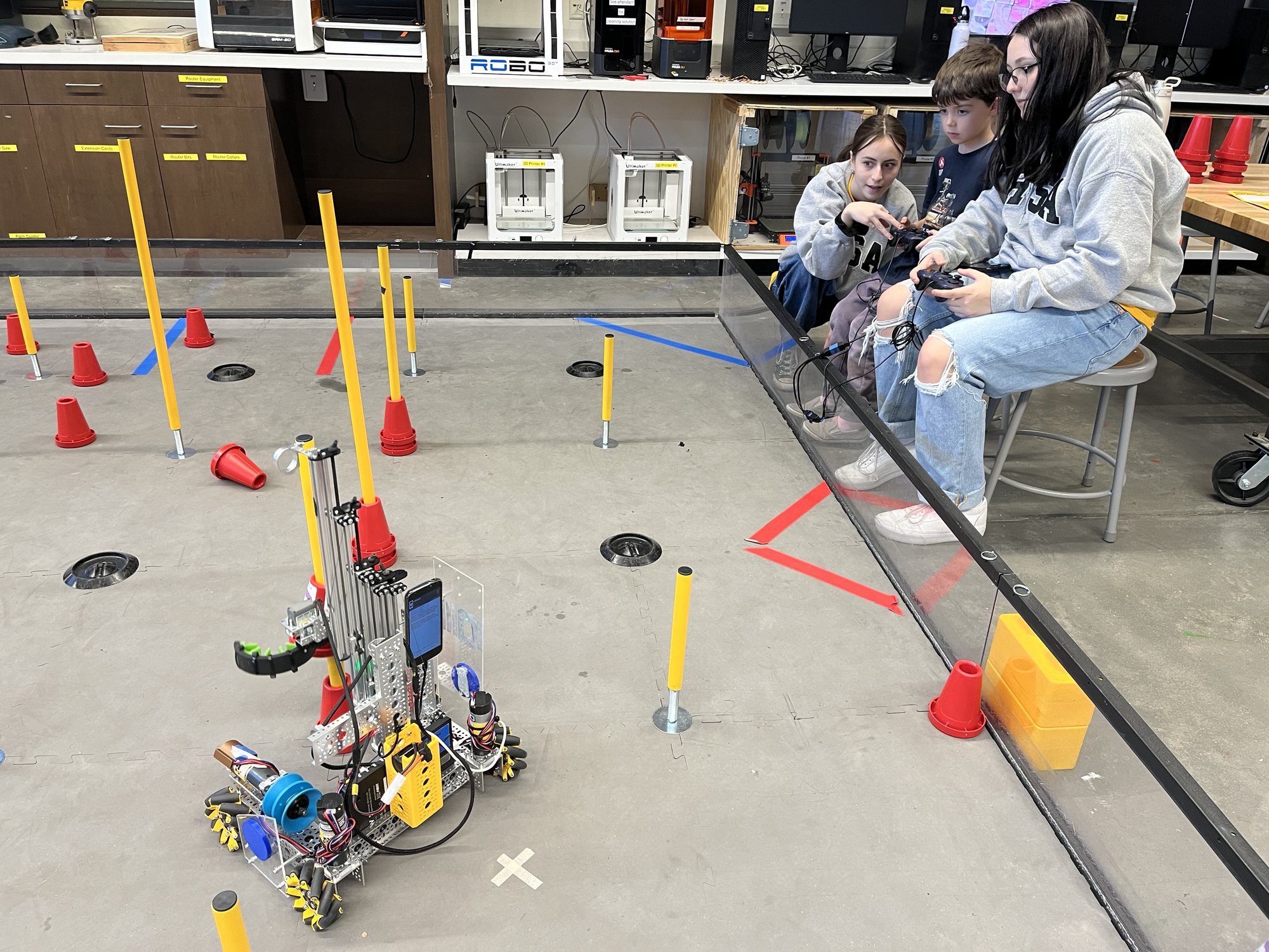 Ben driving a robot at OpenDoor. The objective was to pick up rings and stack them on one of the poles :)