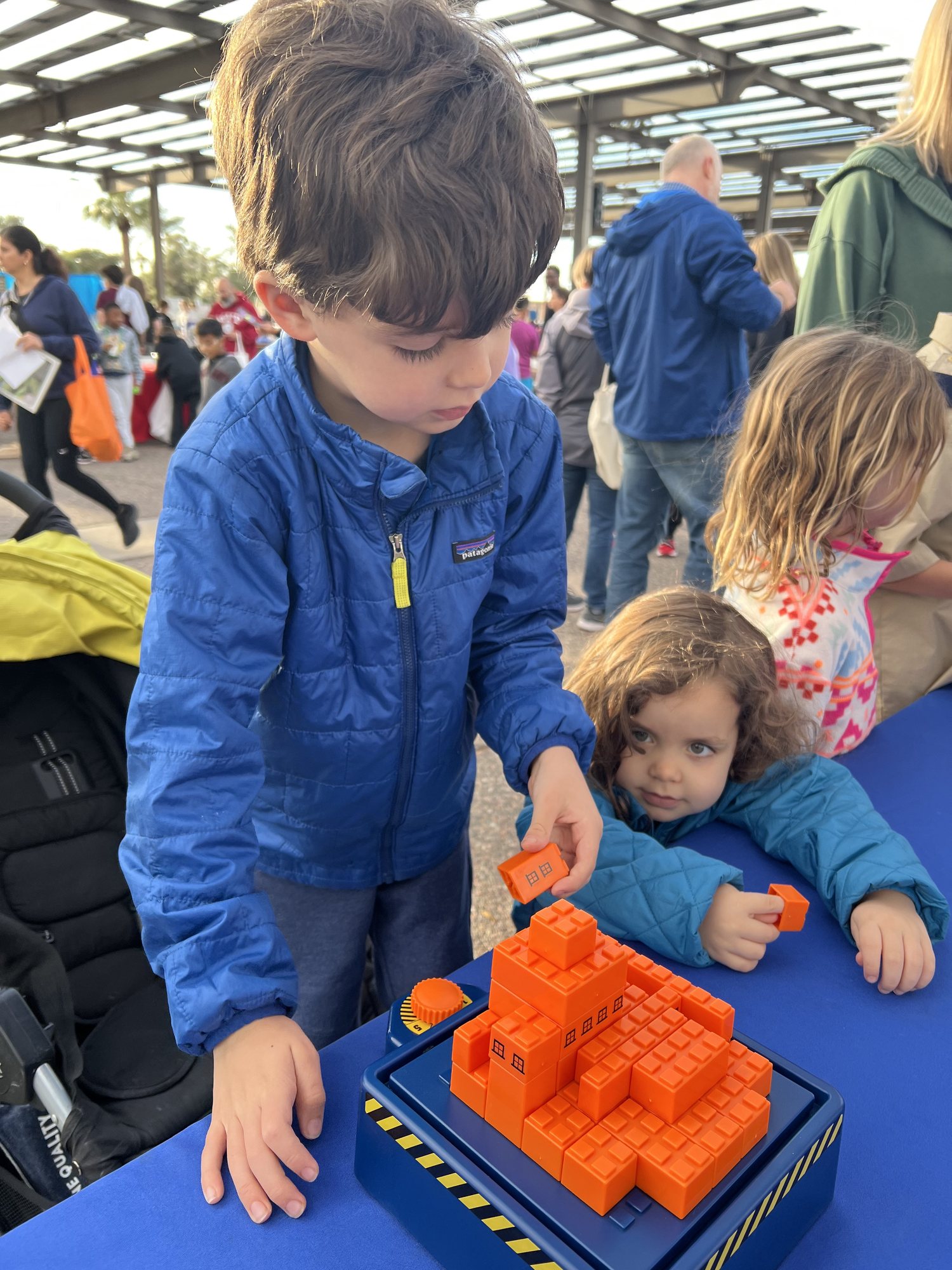 Geeks Night Out - Tempe's annual STEAM festival - at our local library. The kids got to build a marble run, play with legos, build a stable building on an earthquake table, look through microscopes and drive robots.