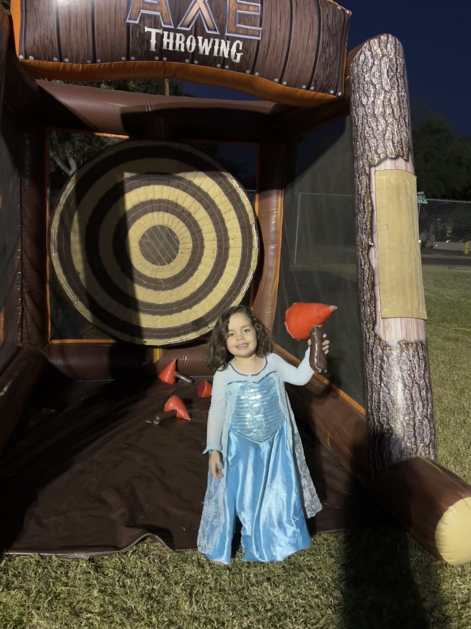 Throwing axes at the school fair.