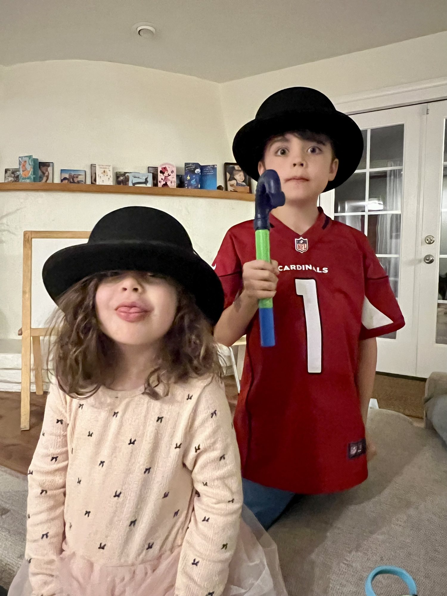 Trying on Grandpa Jim's hats.