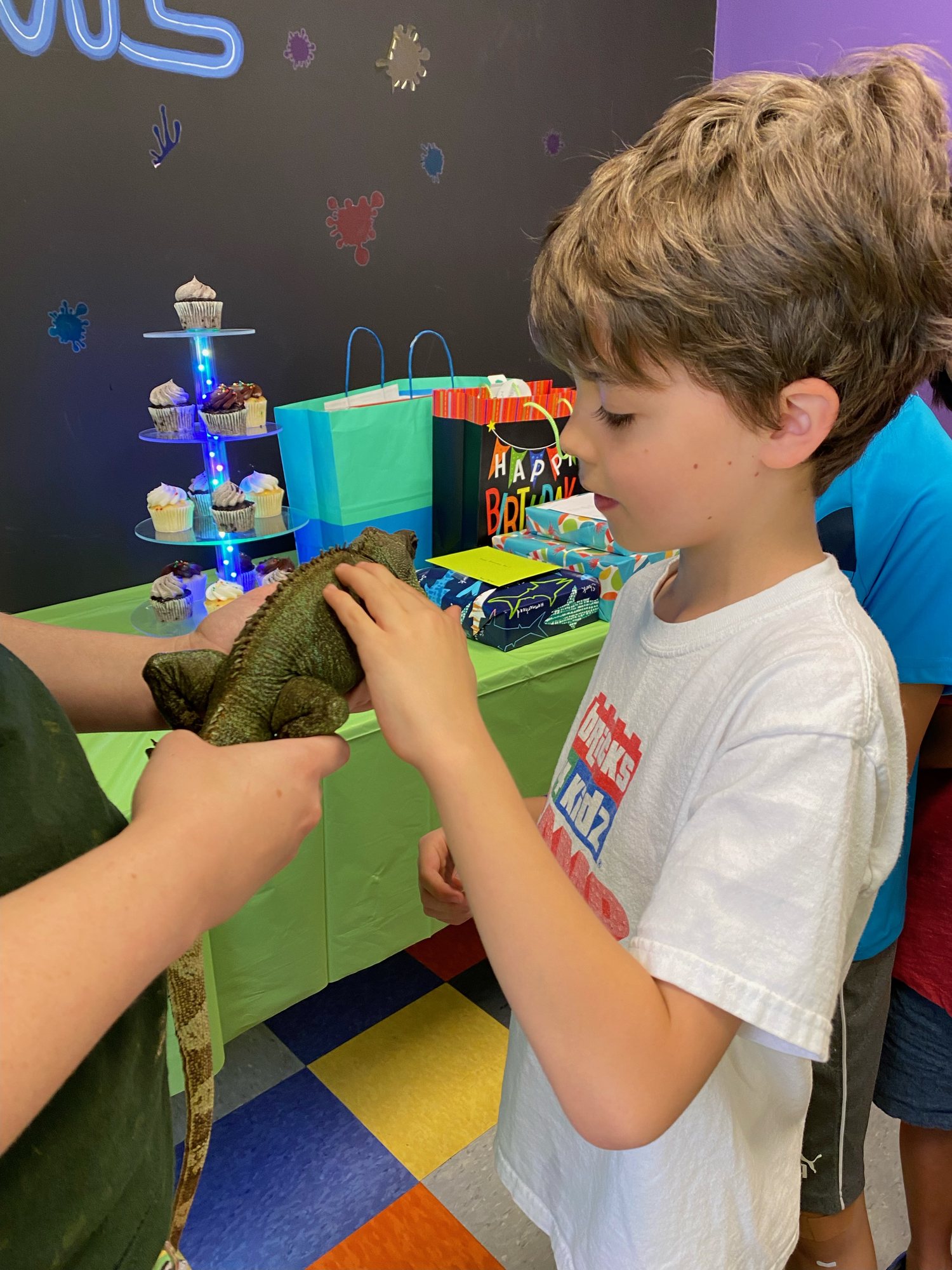 Meeting an iguana at his birthday party :)