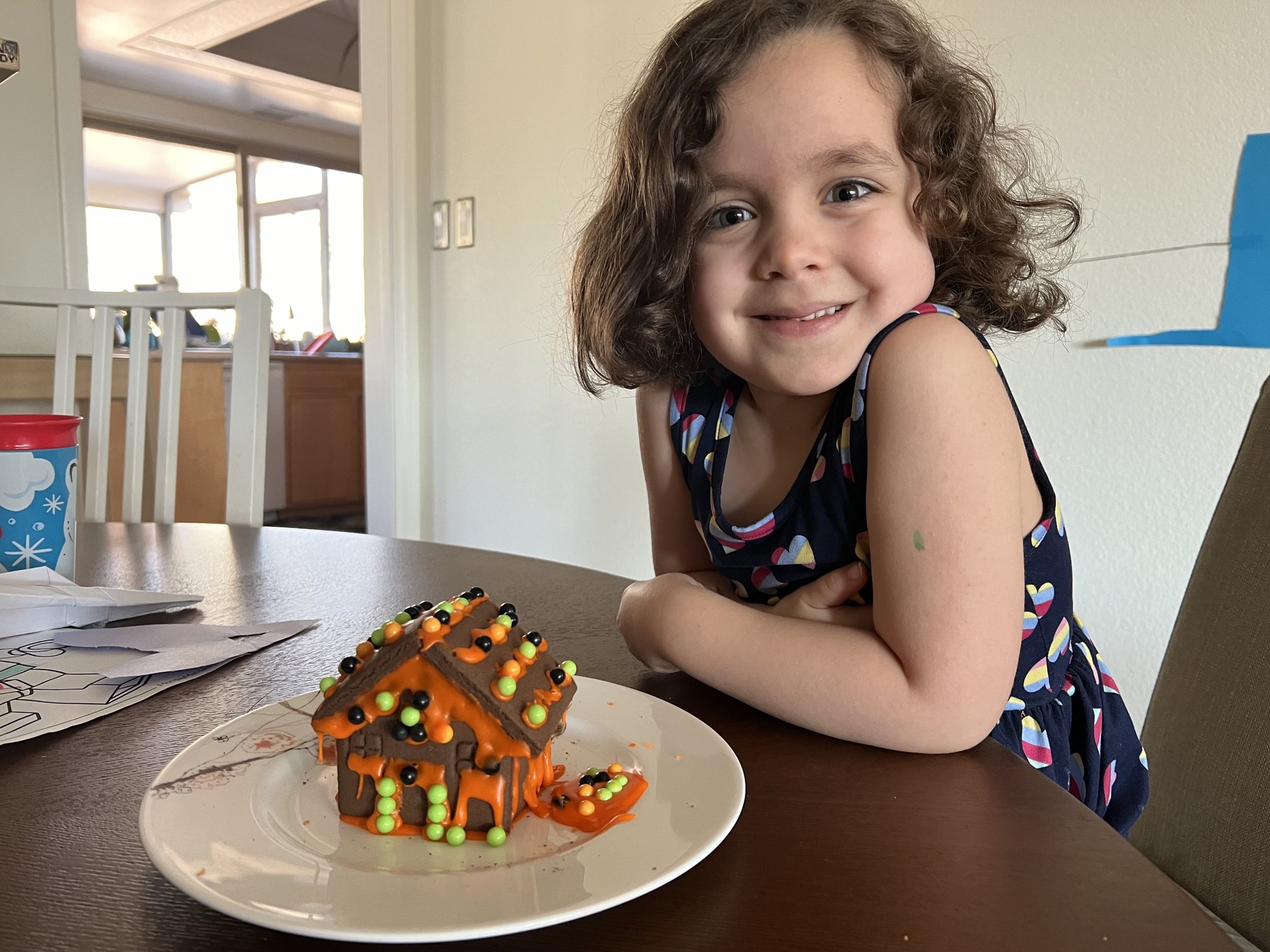 Nora with her Halloween gingerbread house (which they apparently make for every occasion now).