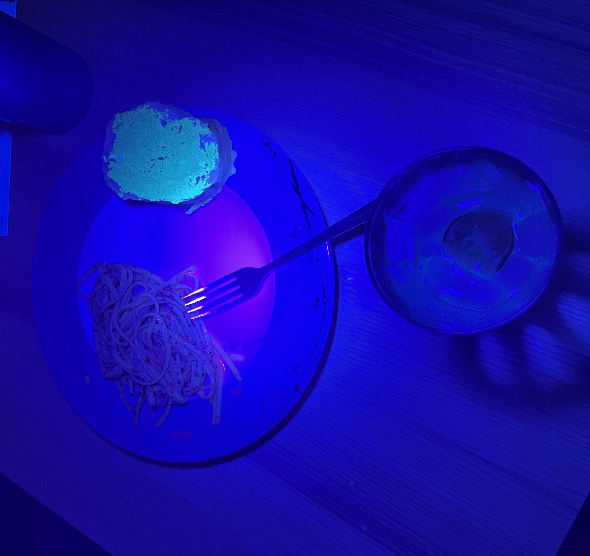 Our fluorescent dinner! We ate under blacklights lol.